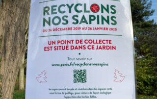 Opération "Recyclons nos sapins", sur la grille du square de la Roquette, Paris 11e (75)